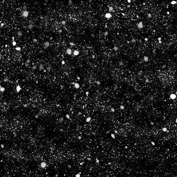abstract wallpaper with falling snow on black background