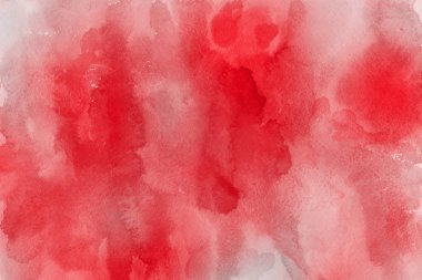 Kağıt arka plan üzerinde kırmızı sulu boya boya