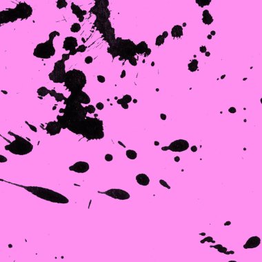 Soyut siyah boya doku pembe bir arka plan üzerinde splatters