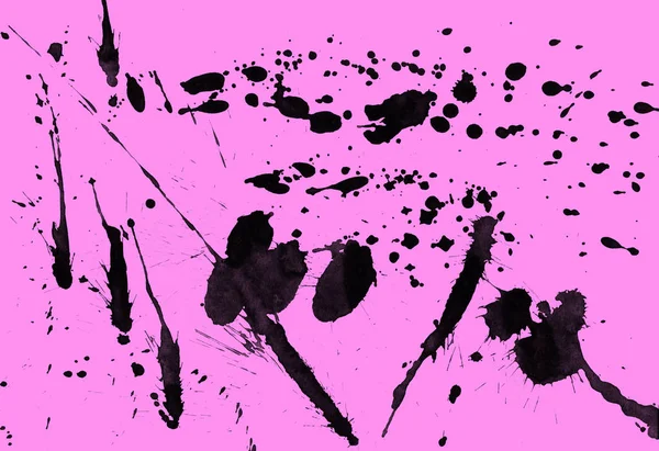 abstract black paint splatters texture on pink background