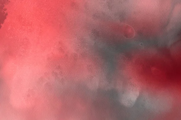 red watercolor paint on paper abstract background