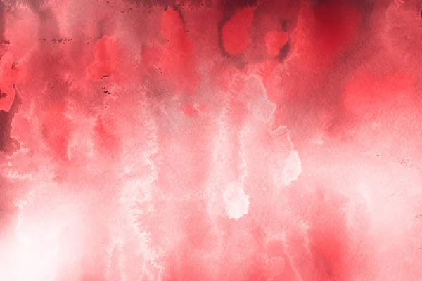 Kağıt arka plan üzerinde kırmızı sulu boya boya