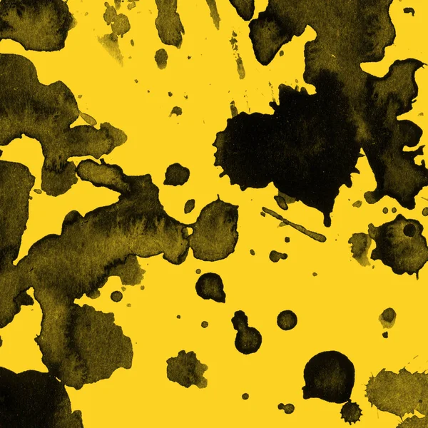 abstract black paint splatters texture on yellow background