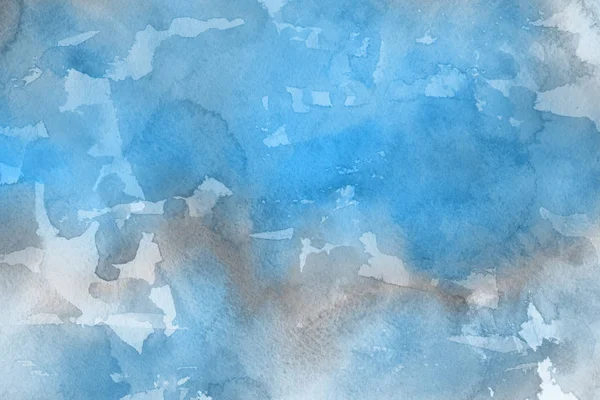 blue watercolor paint on paper abstract background