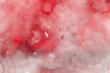 Kağıt arka plan üzerinde kırmızı sulu boya boya
