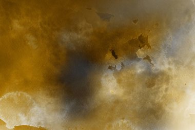 Kağıt arka plan üzerinde altın suluboya boya