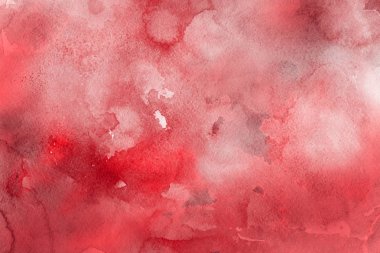 Kağıt arka plan üzerinde kırmızı sulu boya boya