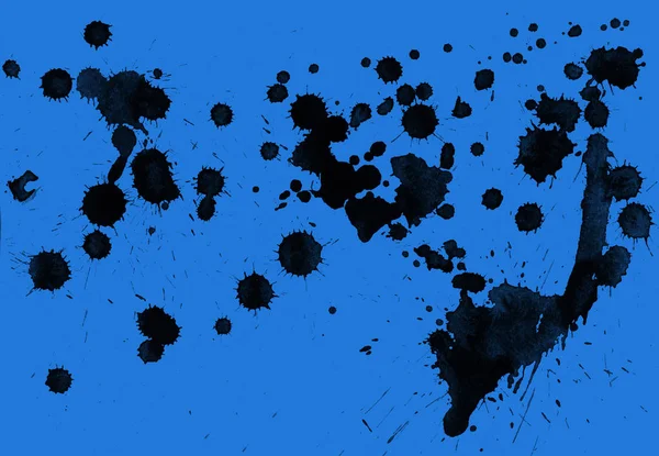 abstract black paint splatters texture on blue background