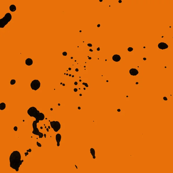 Absztrakt Fekete Festék Splatters Textúra Narancssárga Háttér — Stock Fotó