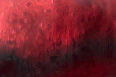 Kağıt arka plan üzerinde kırmızı sulu boya boya