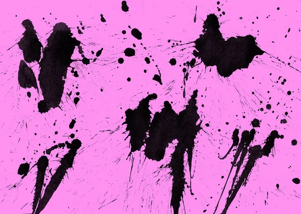 abstract black paint splatters texture on pink background