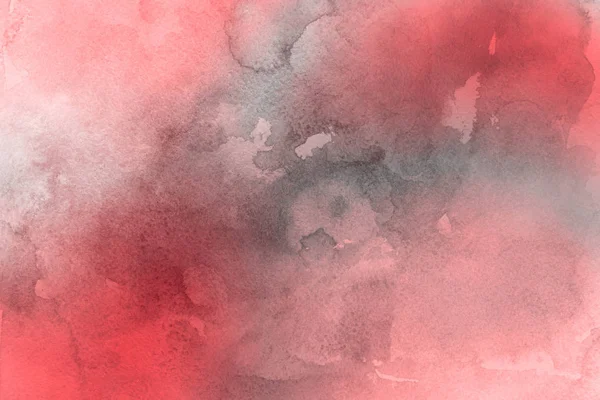 red watercolor paint on paper abstract background