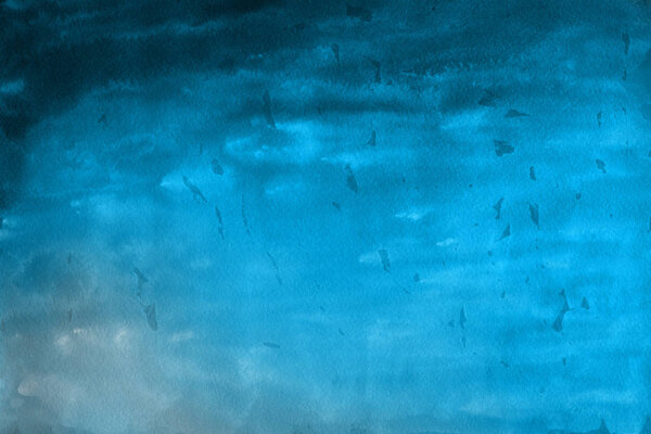blue watercolor paint on paper abstract background