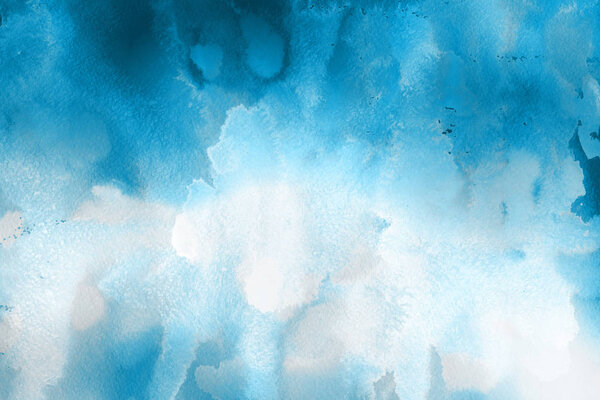 blue watercolor paint on paper abstract background