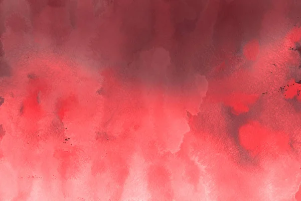 red watercolor paint on paper abstract background