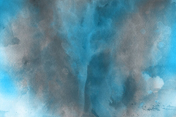 blue watercolor paint on paper abstract background
