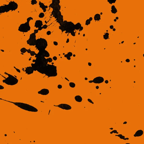 Soyut siyah boya doku turuncu zemin üzerine splatters