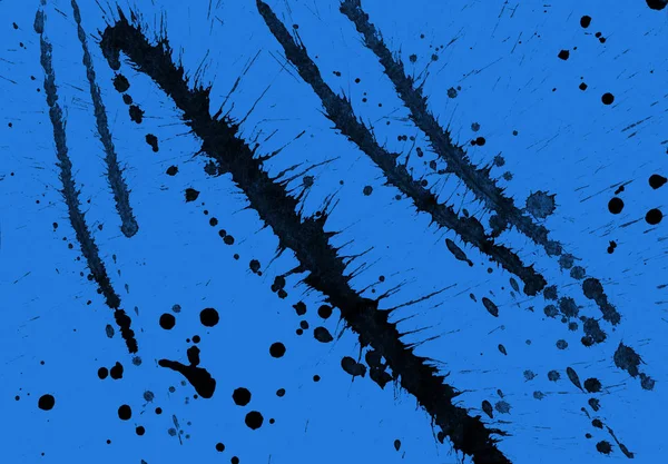 Abstrakte Schwarze Farbspritzer Textur Auf Blauem Hintergrund — Stockfoto
