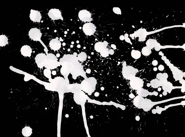 abstract white paint splatters texture on black background