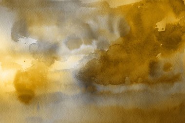 Kağıt arka plan üzerinde altın suluboya boya