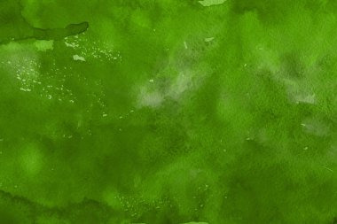 Kağıt arka plan üzerinde yeşil suluboya boya