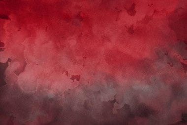 Kağıt arka plan üzerinde kırmızı sulu boya boya