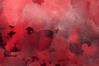 Kağıt arka plan üzerinde kırmızı sulu boya boya