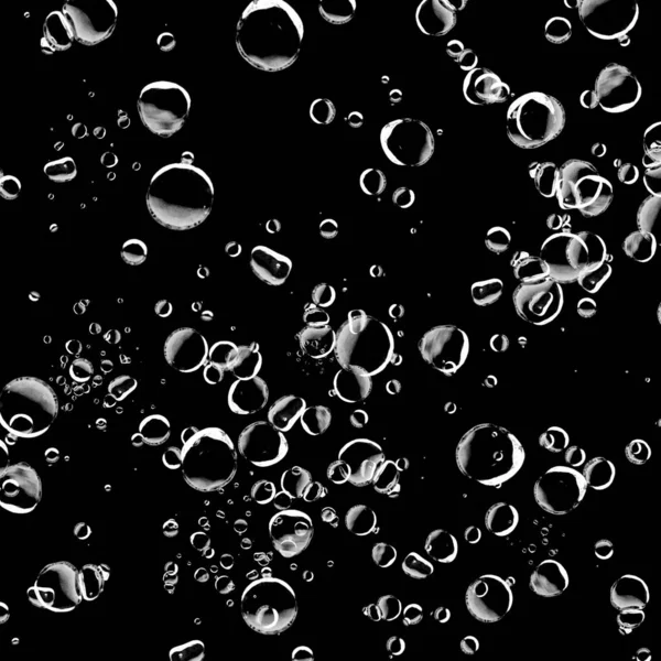 Siyah arka plan üzerine beyaz su kabarcıkları izole. Su damla yağmur. Sualtı oksijen.