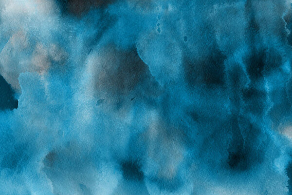 blue watercolor paint on paper abstract background