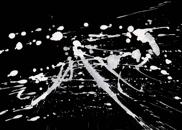 abstract white paint splatters texture on black background