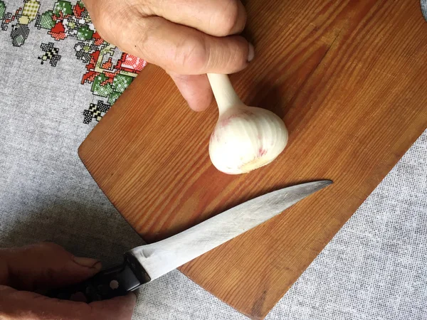 Garlic on the wood desk on the kitchen