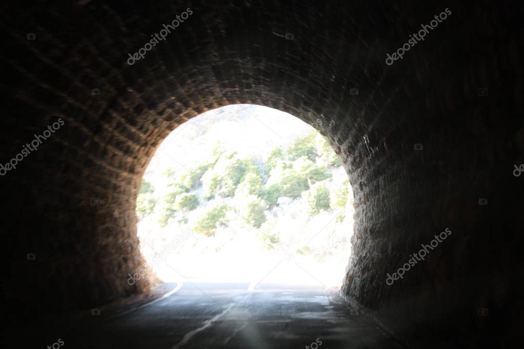 Road with tunnel from Dalmatia to Istria in Croatia with Dinaric Alps.