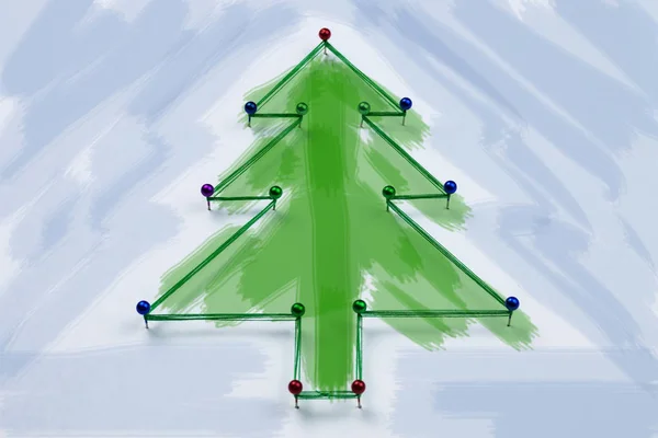 Pimleri ve mavi bir arka plan iş parçacığı Noel ağacı yapılmış