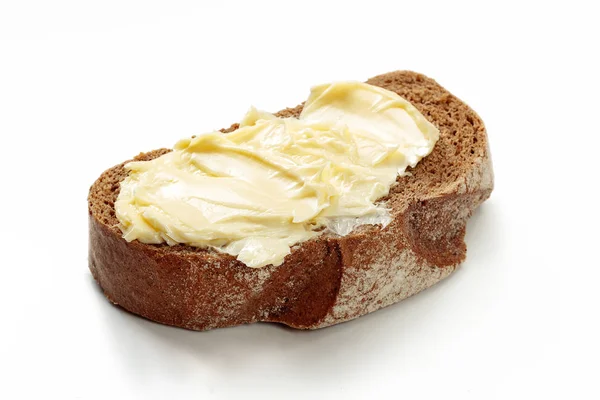 用孤立的白色背景上的面包黄油 — 图库照片