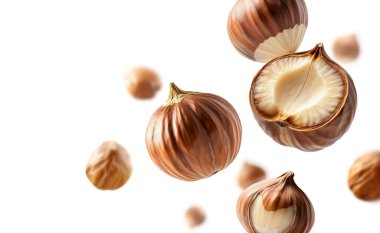 Beyaz arka planda bir grup fındık fırlatılması. Tasarım için örnek