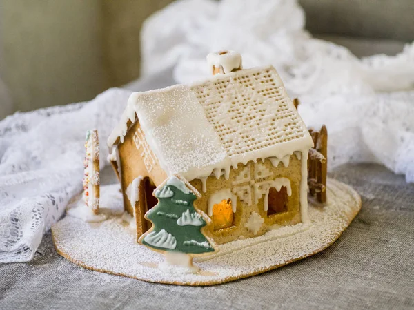 Decorative christmas gingerbread house in snow — Stock Photo, Image