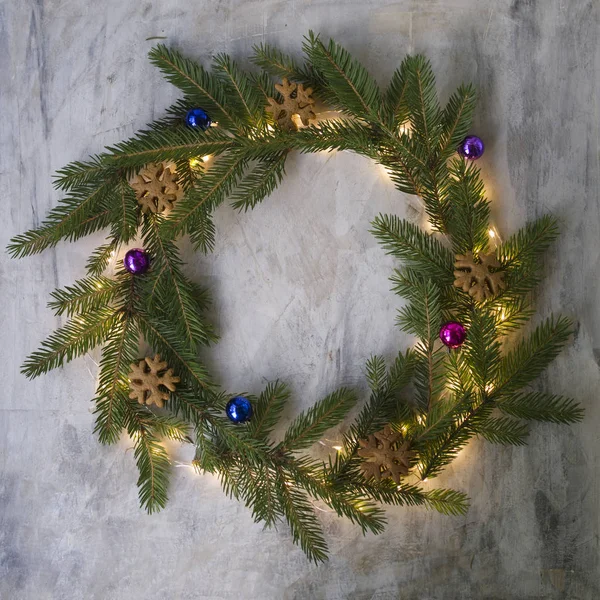 Christmas Wreath Made Fir Branches Cookies Colored Balls Glowing Lights — Stock Photo, Image