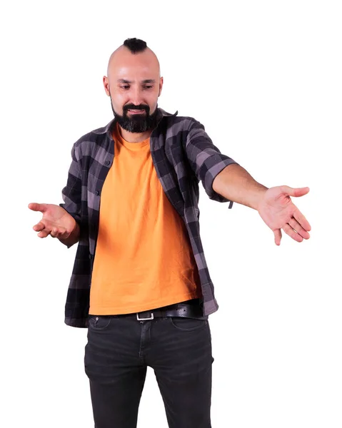 Young hispanic man pointing at something with disdain — Stock Photo, Image