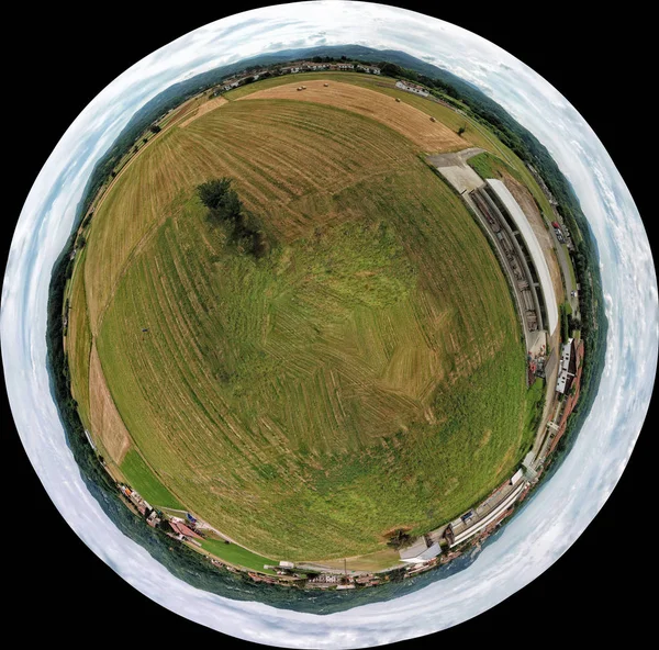 aerial view of packed hay bale harvested fodder balls on wheat field