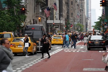 NEW YORK, USA - MAY 25 2018 - Yellow cabs and cars stucked in traffic in the Midtown Manhattan jam clipart