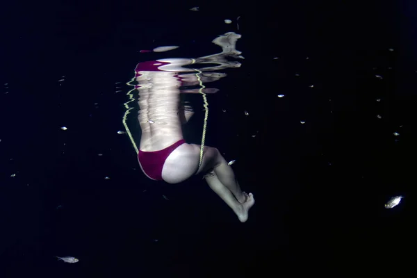 beautiful legs white young girl woman underwater on teeter totter swing