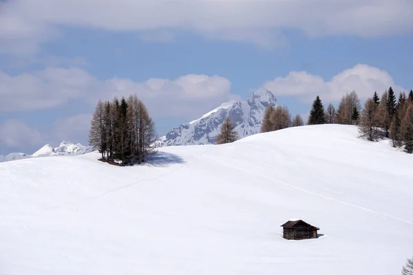 Isolated wood mountain house cabin hut covered by snow