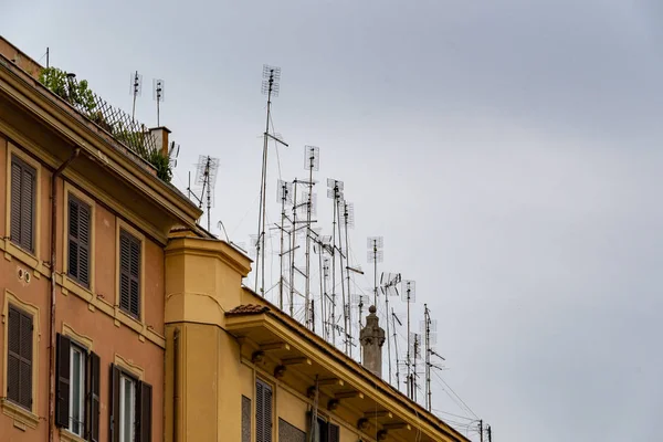 Many television antenna in rome palace roof