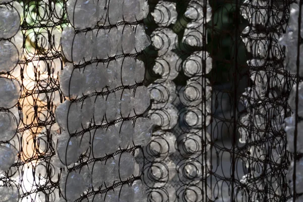 Many plastic bottle on grid — Stock Photo, Image