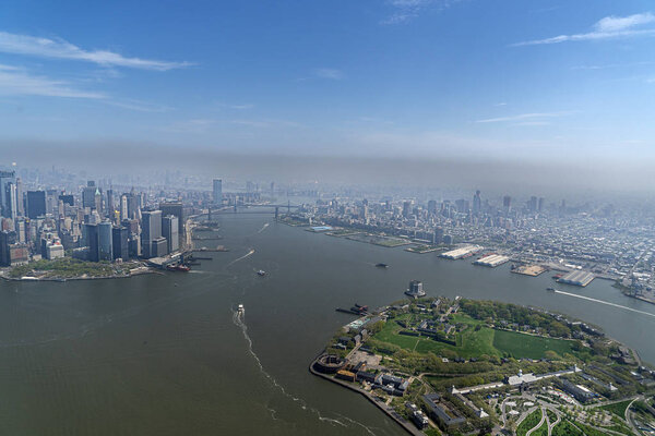 Governor island and new york city manhattan aerial view from helicopter