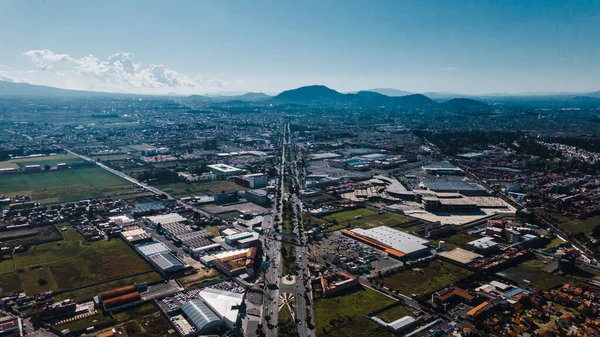 Aerial photography of the magical town of Metepec, State of Mexico, Mexico, where its main roads and overpasses can be seen, photography of symmetrical avenues.