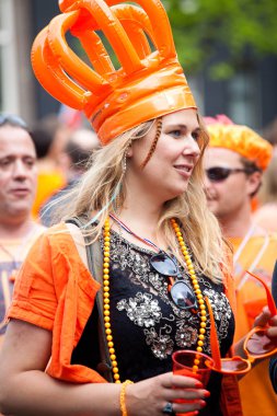 Amsterdam, The Netherlands, April 30, 2014: celebration of the public national holiday King's day - Koningsdag - held every year on 30th of April in the entire country to celebrate King Willem's birthday clipart