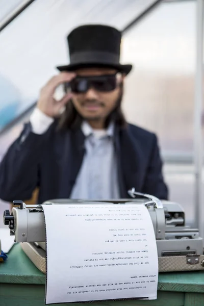 Amsterdam, The Netherlands, 12-14 Septembre 2014, during West'ival, an open air free Cinema and culture festival on Mercatorplein - artistic installation, man typewriting