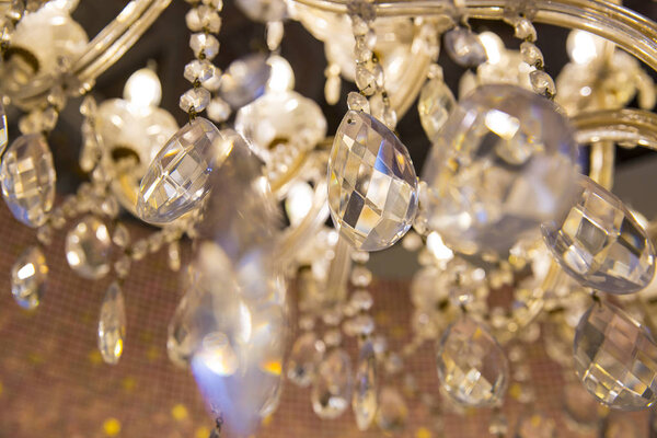 close up on ancient crystal chandelier 