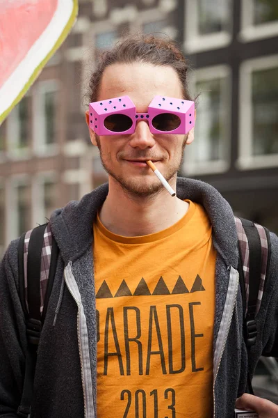 Amsterdam, The Netherlands, April 30, 2014: celebration of the public national holiday King's day - Koningsdag - held every year on 30th of April in the entire country to celebrate King Willem's birthday